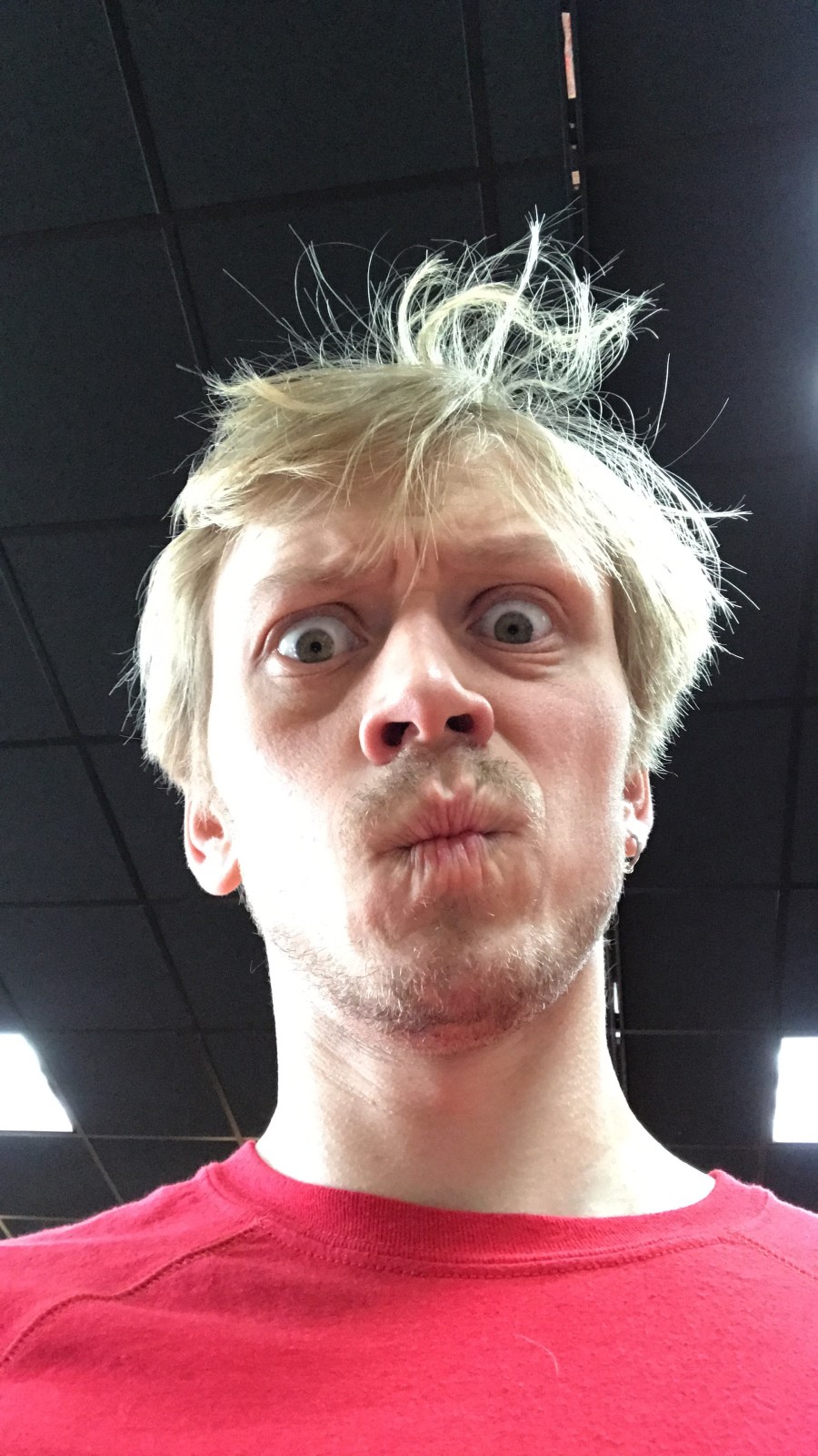 Confused Expression in a Red Shirt. More News?